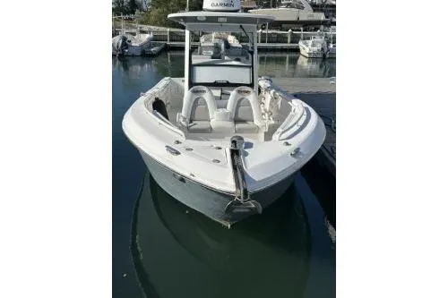 Slide: The Image of 2013 Everglades 275 Center Console boat docked in marina, front view. - 9