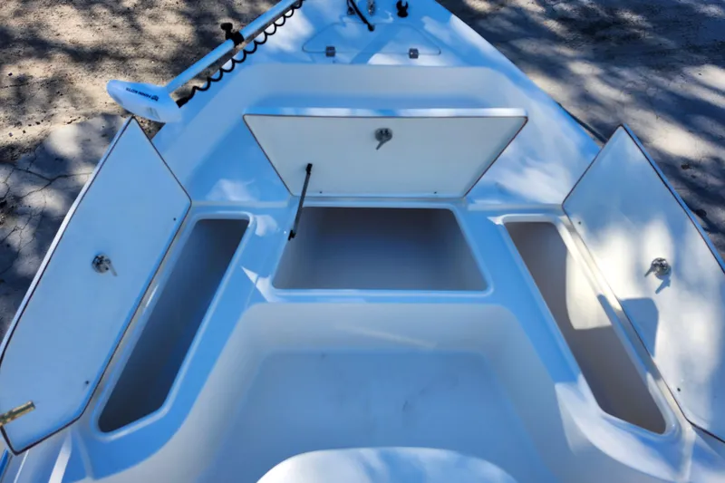 Slide: The Image of Open storage compartments on a 2022 Bulls Bay 2000 boat deck. - 14