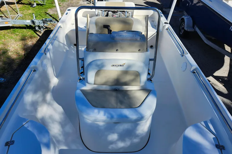 Slide: The Image of 2022 Bulls Bay 2000 boat interior with seating and steering console. - 15