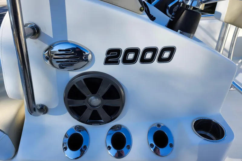 Slide: The Image of Close-up of 2022 Bulls Bay 2000 boat dashboard with speaker and cup holders. - 17
