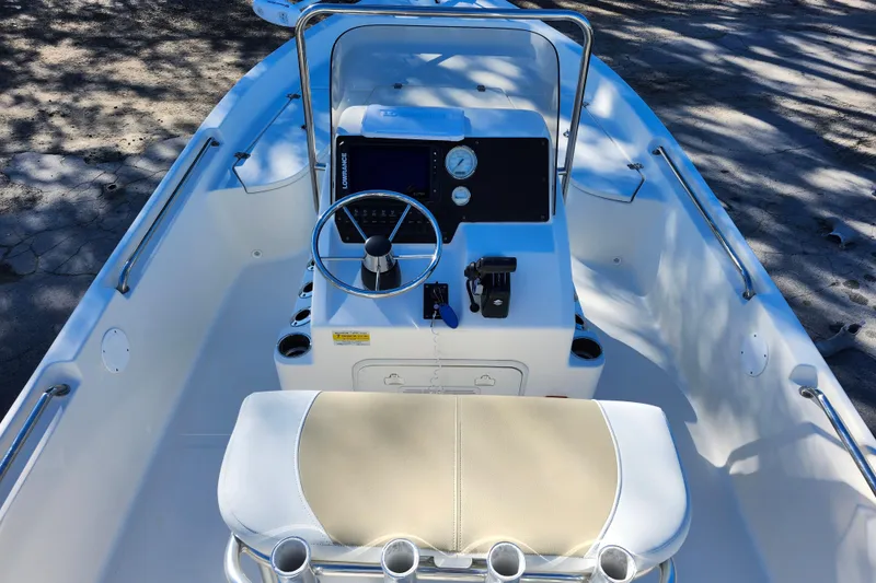 Slide: The Image of 2022 Bulls Bay 2000 boat interior with steering console and seating. - 22