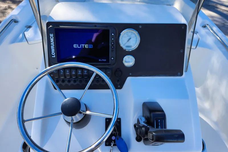 Slide: The Image of Steering console of 2022 Bulls Bay 2000 boat with Lowrance Elite FS display. - 23