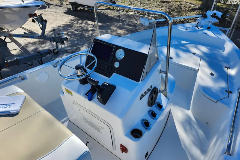 Slide: The Image of 2022 Bulls Bay 2000 boat interior with steering console and seating area. - 24
