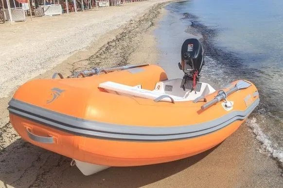 Slide: The Image of Orange Caribe L-9 inflatable boat on sandy beach, 2025 model. - 18