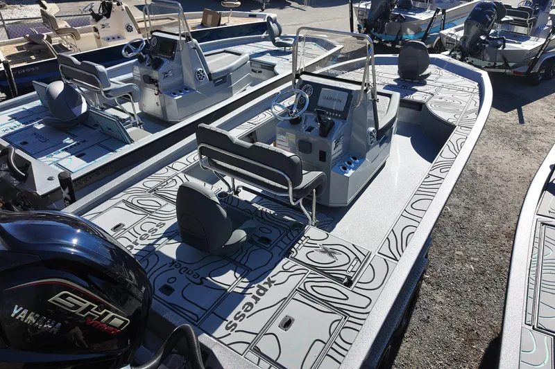 Slide: The Image of 2026 Xpress X23B Bay Lounge boat with Yamaha engine, featuring modern design and seating. - 4