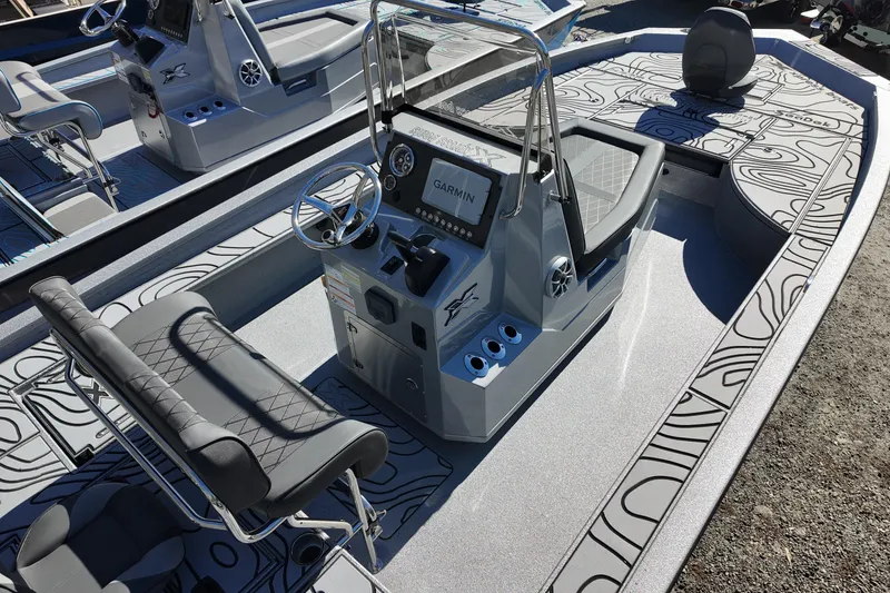 Slide: The Image of 2026 Xpress X23B Bay Lounge boat interior with modern console and seating. - 5