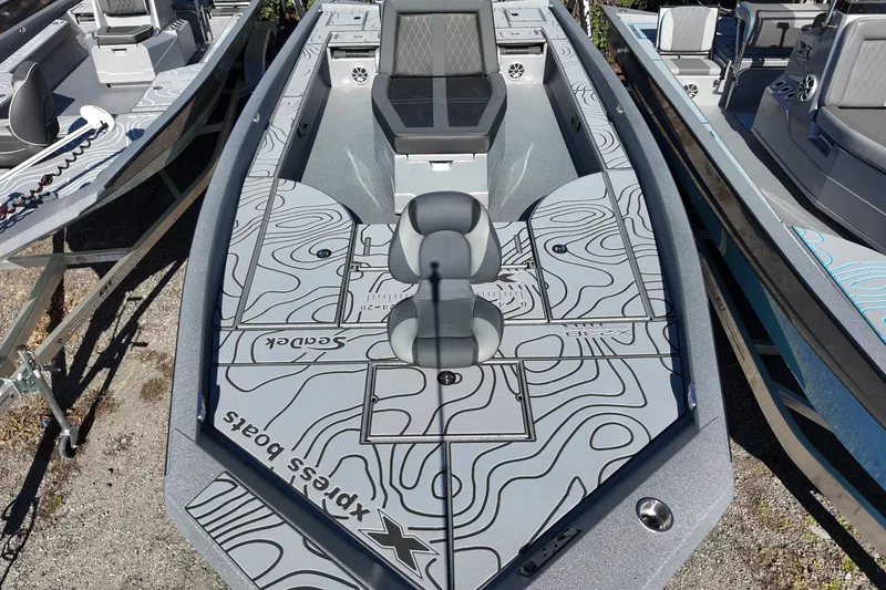 Slide: The Image of 2026 Xpress X23B Bay Lounge boat with stylish deck design and seating. - 9