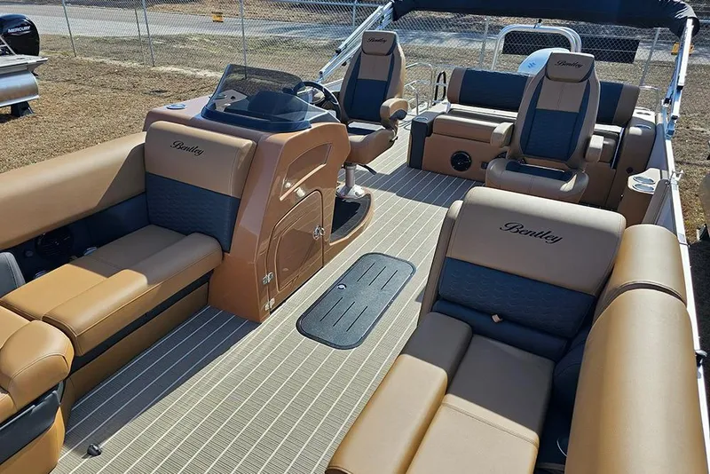 Slide: The Image of 2023 Bentley Pontoons 223 Elite Swingback DC interior with luxurious seating and helm. - 10