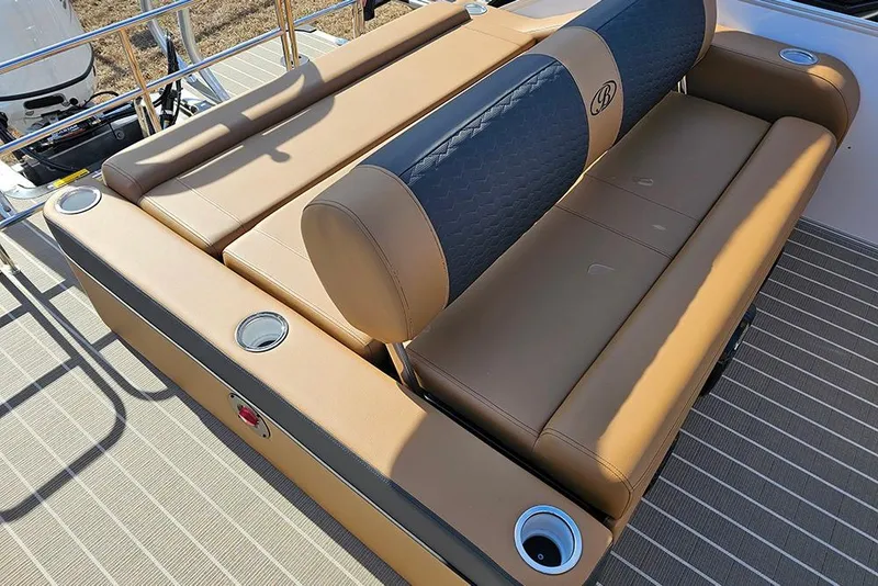 Slide: The Image of 2023 Bentley Pontoons 223 Elite Swingback DC with luxurious tan seating and cup holders. - 11