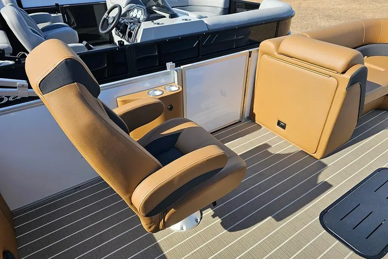 Slide: The Image of 2023 Bentley Pontoons 223 Elite Swingback DC interior with tan leather seating and modern dashboard. - 17