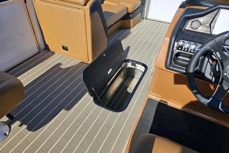 Slide: The Image of 2023 Bentley Pontoons 223 Elite Swingback DC interior with open storage compartment. - 19