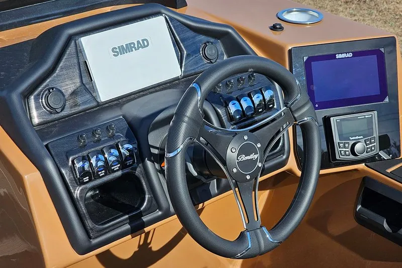 Slide: The Image of 2023 Bentley Pontoons 223 Elite Swingback DC dashboard with steering wheel and Simrad displays. - 23