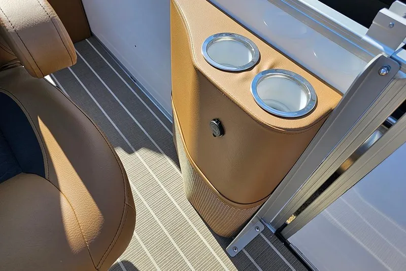 Slide: The Image of 2023 Bentley Pontoons 223 Elite Swingback DC interior with cup holders and tan upholstery. - 28