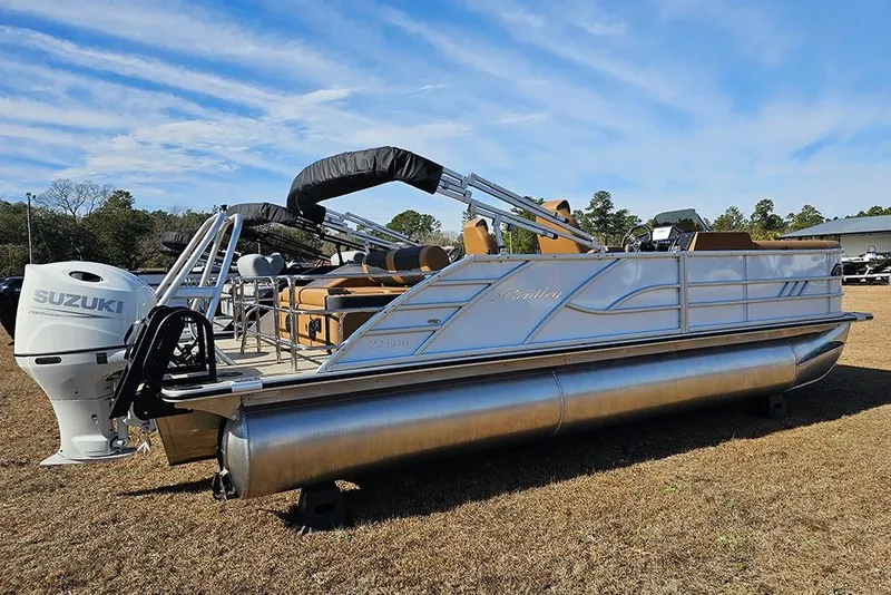 Slide: The Image of 2023 Bentley Pontoons 223 Elite Swingback DC with Suzuki engine on grassy field. - 4