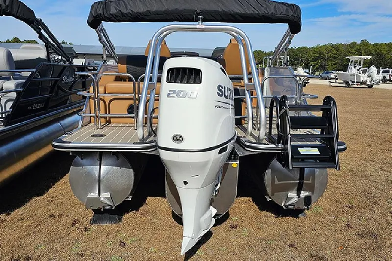 Slide: The Image of 2023 Bentley Pontoons 223 Elite Swingback DC with Suzuki outboard motor, rear view. - 8