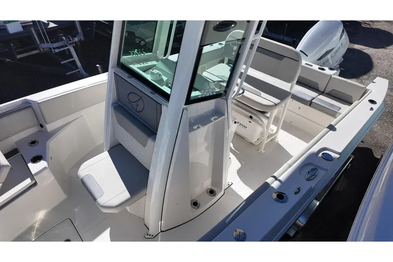 Slide: The Image of 2026 Sailfish 232 CC boat interior with seating and console, showcasing modern design. - 10