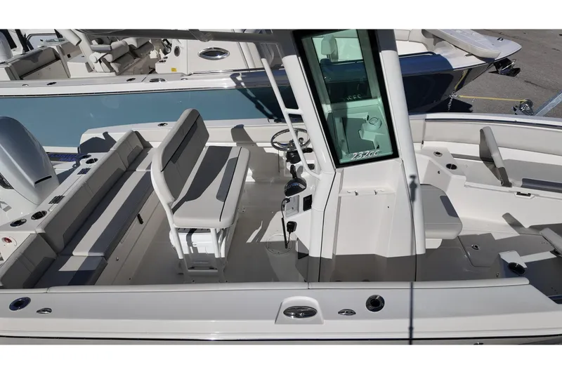 Slide: The Image of 2026 Sailfish 232 CC boat interior with seating and console, showcasing modern design. - 17