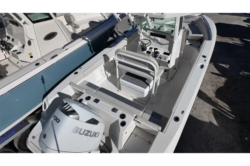 Slide: The Image of 2026 Sailfish 232 CC boat with Suzuki engine, featuring a spacious center console design. - 4