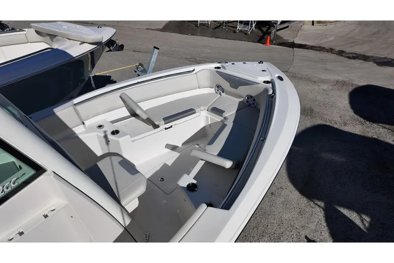Slide: The Image of 2026 Sailfish 232 CC boat interior with seating and cup holders. - 7