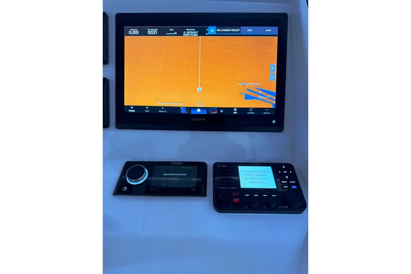 Slide: The Image of 2019 Intrepid 345 Nomad FE dashboard with Garmin navigation and control systems. - 19