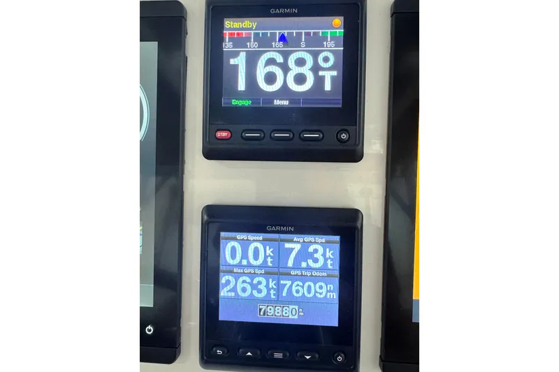 Slide: The Image of Garmin navigation displays on 2019 Intrepid 345 Nomad FE showing speed and heading data. - 21
