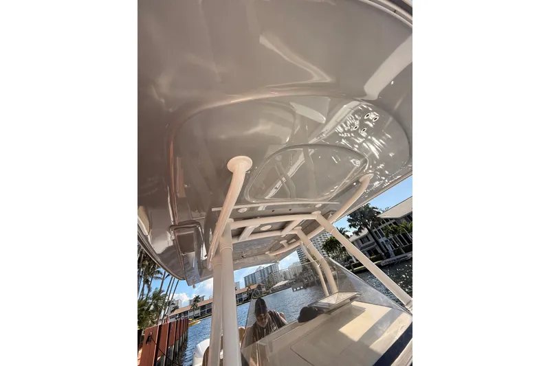 Slide: The Image of 2019 Intrepid 345 Nomad FE boat with sleek design and waterfront view. - 35
