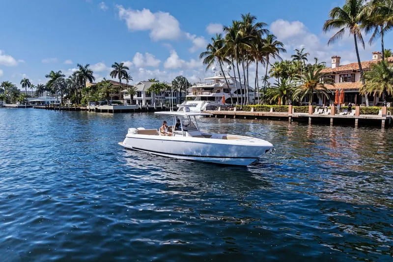 Slide: The Image of 2019 Intrepid 345 Nomad FE boat bathroom with sink and toilet. - 43