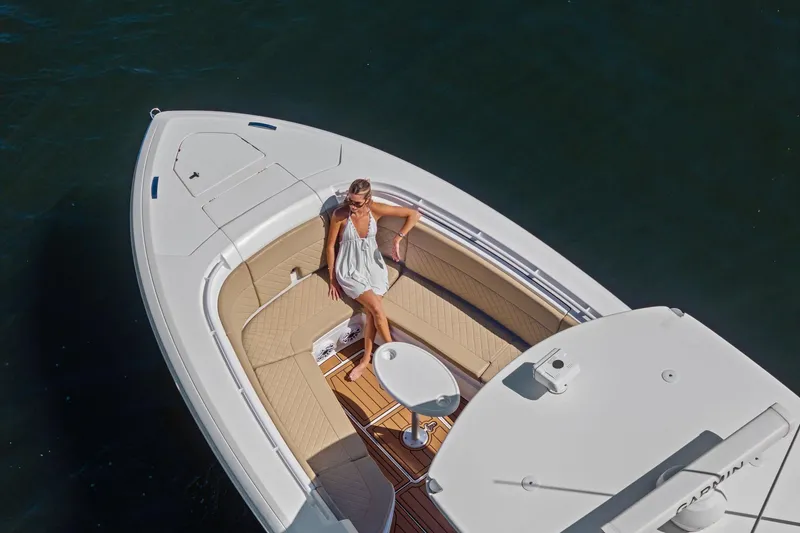 Slide: The Image of 2019 Intrepid 345 Nomad FE boat with sleek design and waterfront view. - 45