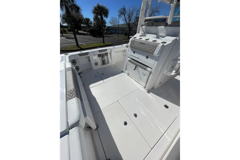 Slide: The Image of 2024 Caymas 34 CT boat interior with seating and storage compartments. - 25