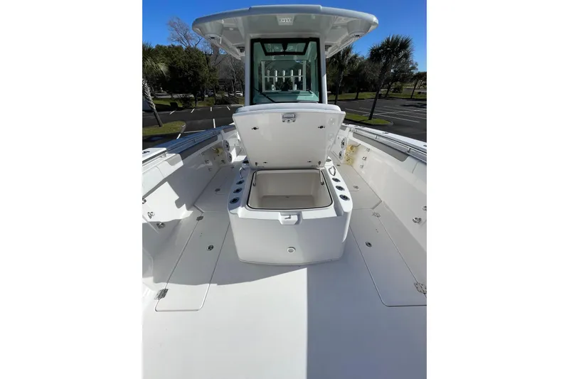 Slide: The Image of 2024 Caymas 34 CT boat deck with open storage compartment, showcasing spacious design. - 27