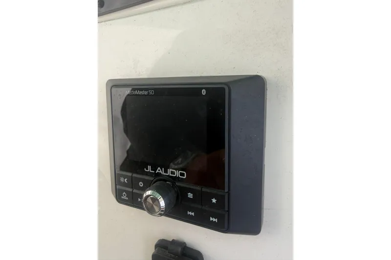 Slide: The Image of JL Audio MediaMaster 50 on 2021 Pioneer 222 Sportfish boat dashboard. - 10