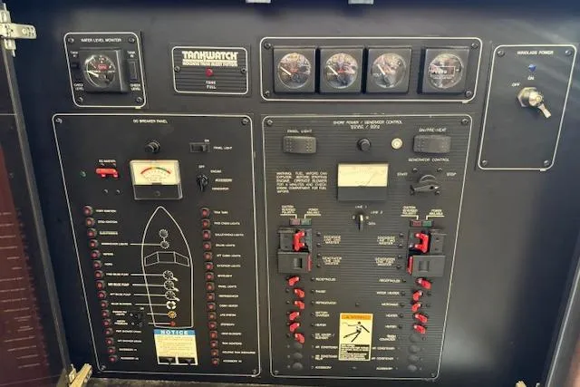 Slide: The Image of Control panel of a 1995 Bayliner 3988 Motoryacht with gauges and switches. - 12