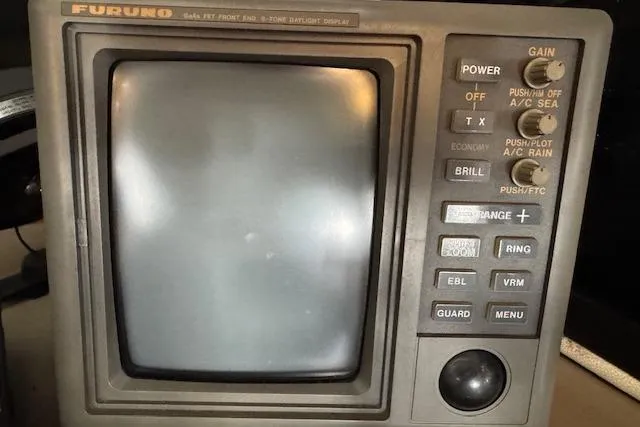 Slide: The Image of Furuno radar display on 1995 Bayliner 3988 Motoryacht, featuring various control buttons and knobs. - 13