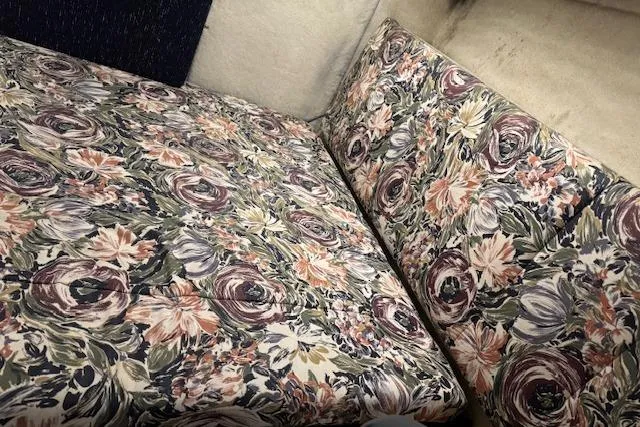Slide: The Image of Floral-patterned seating inside a 1995 Bayliner 3988 Motoryacht. - 19