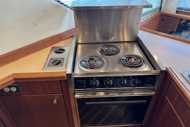 Slide: The Image of Stainless steel stove in 1995 Bayliner 3988 Motoryacht kitchen area. - 5