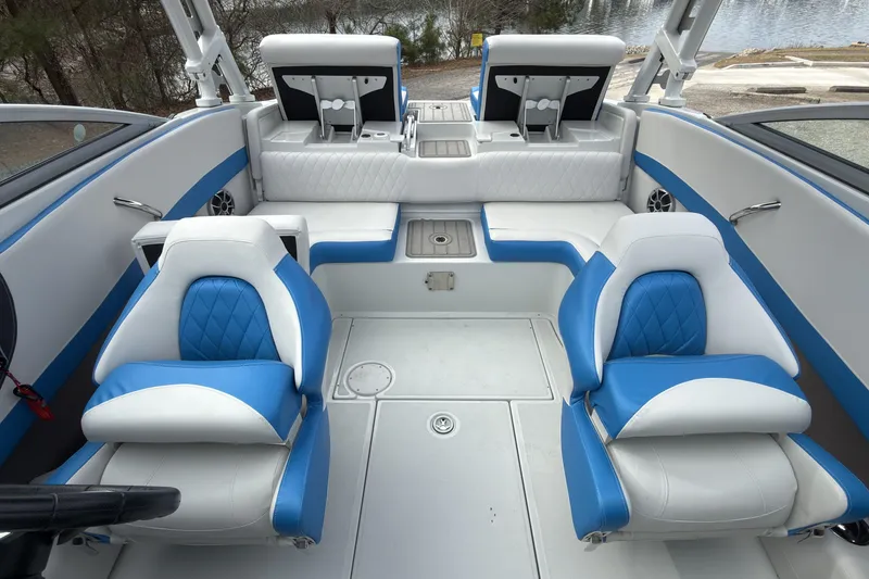 Slide: The Image of 2026 Crownline 220 SS boat interior with blue and white seating, modern design. - 8