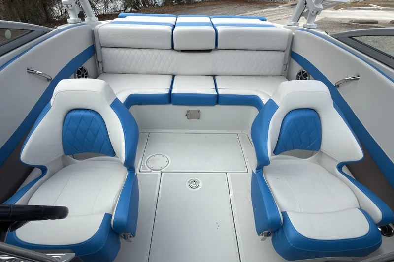 Slide: The Image of 2026 Crownline 220 SS boat interior with blue and white seating, featuring modern design. - 9