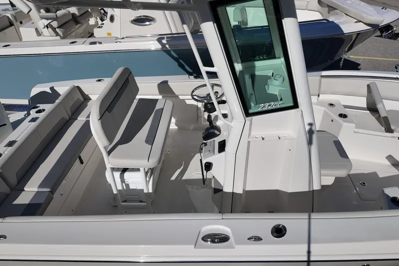 Slide: The Image of 2026 Sailfish 252 CC boat interior with seating and steering console. - 17
