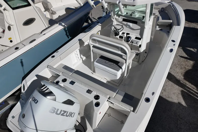 Slide: The Image of 2026 Sailfish 252 CC boat with Suzuki engine, featuring a modern center console design. - 4