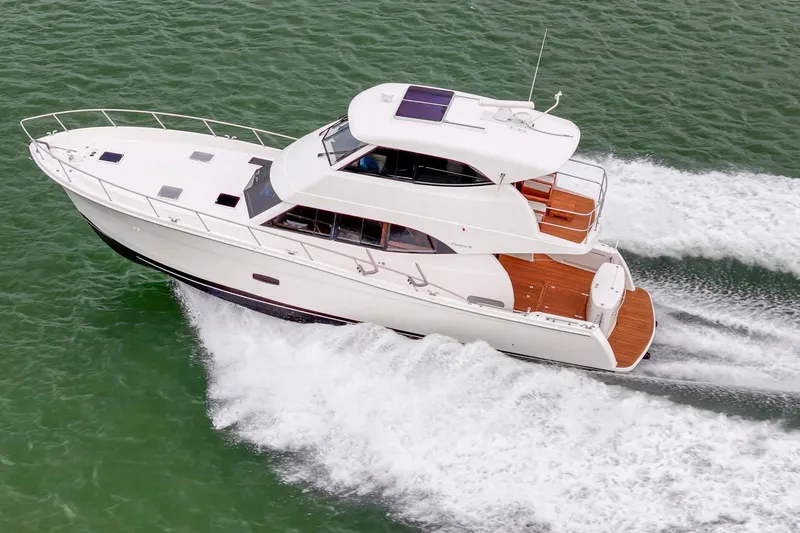 Slide: The Image of 2014 Maritimo M50 yacht cruising on open water, aerial view. - 11