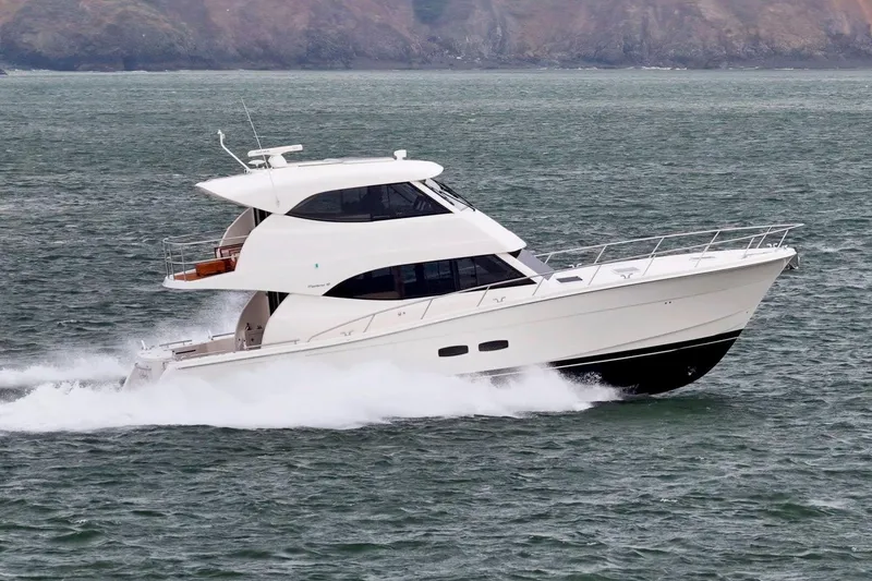Slide: The Image of 2014 Maritimo M50 yacht cruising on open water, showcasing sleek design and performance. - 15