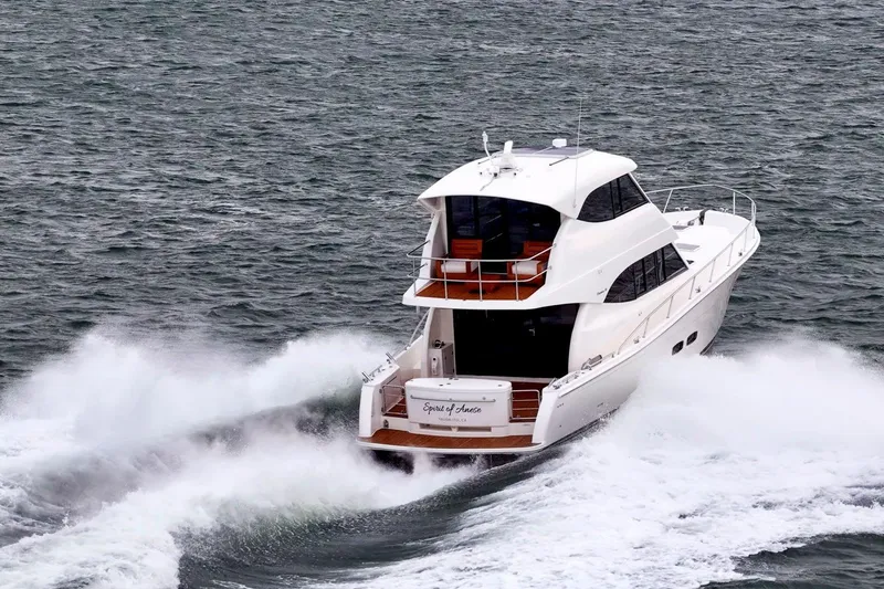 Slide: The Image of 2014 Maritimo M50 yacht cruising through ocean waves. - 16
