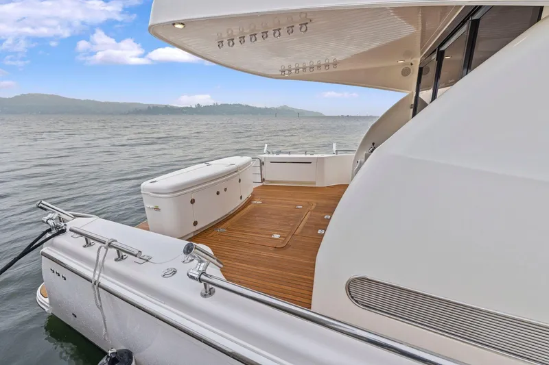Slide: The Image of 2014 Maritimo M50 yacht with teak deck, docked on calm waters. - 20