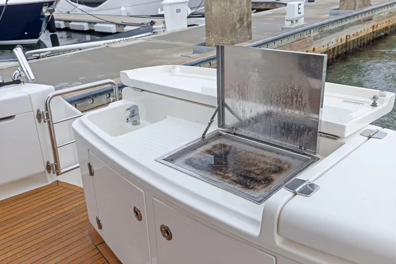 Slide: The Image of 2014 Maritimo M50 yacht with outdoor sink and grill at marina. - 26