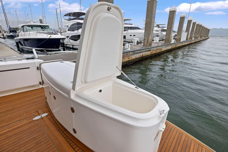 Slide: The Image of Open storage compartment on 2014 Maritimo M50 yacht docked at marina. - 27