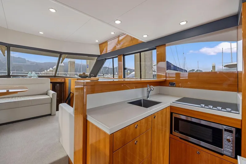 Slide: The Image of Luxurious interior of 2014 Maritimo M50 yacht with modern kitchen and seating area. - 34