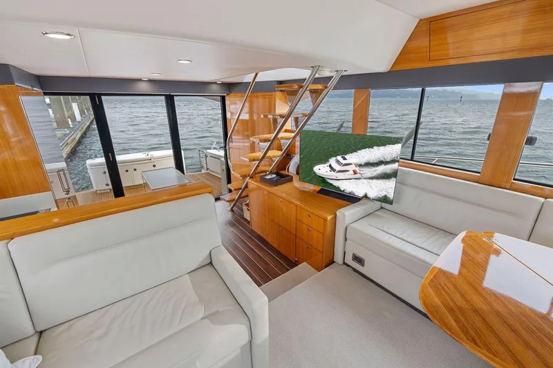 Slide: The Image of Luxurious interior of 2014 Maritimo M50 yacht with elegant wood finishes and waterfront view. - 38