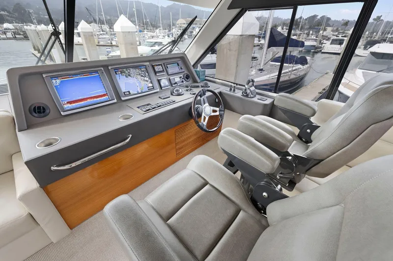 Slide: The Image of Luxurious 2014 Maritimo M50 yacht helm with advanced navigation systems and plush seating. - 46