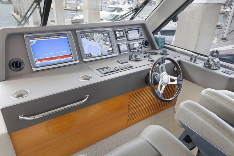 Slide: The Image of Helm of 2014 Maritimo M50 yacht with navigation screens and controls. - 47
