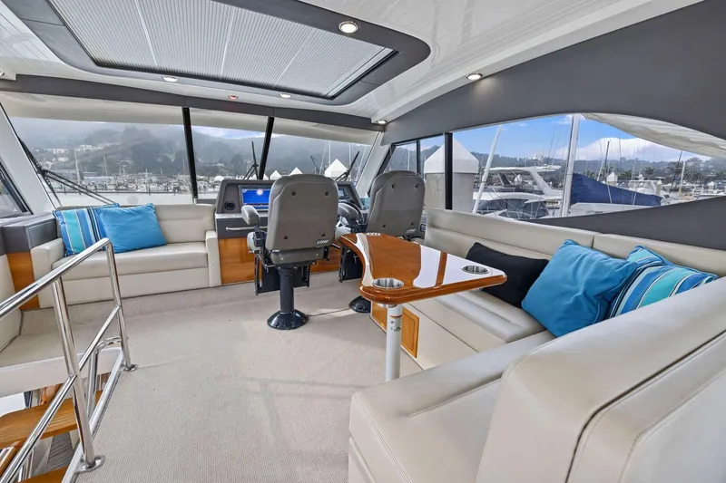 Slide: The Image of Luxurious interior of 2014 Maritimo M50 yacht with plush seating and helm station. - 52